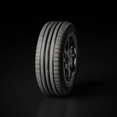 Automotive tire with intricate tread pattern.