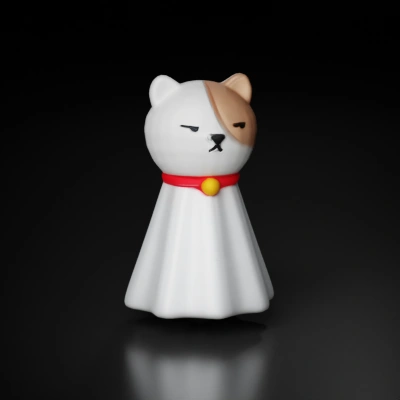 Toy cat figurine with cape, closed eyes.