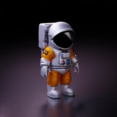 Astronaut in spacesuit, helmet with reflective visor.