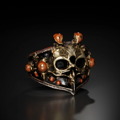 Ornate skull-themed ring with intricate detail.