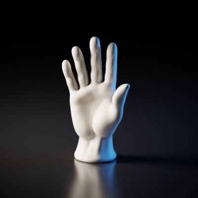 Human-like hand sculpture, raised, fingers extended.