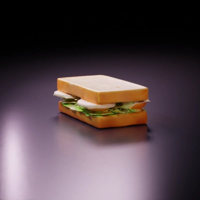 Sandwich with sliced tomatoes, lettuce, and boiled eggs.