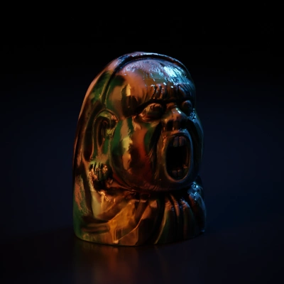 Screaming stone idol with intricate carvings.