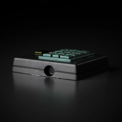 Electronic keypad with numeric buttons and speaker.