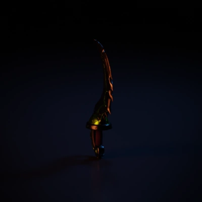 Curved fantasy dagger with glowing parts.