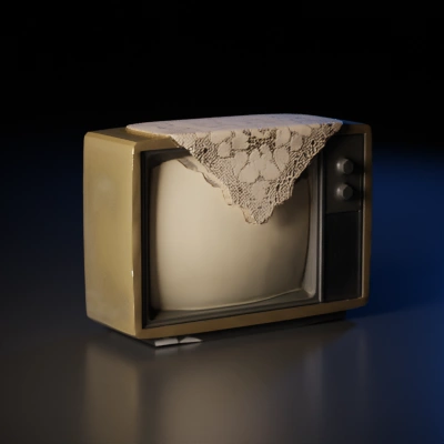 Vintage TV with lace doily cover.
