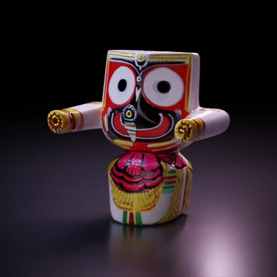 Decorative traditional figure with owl-like eyes, ornate patterns.