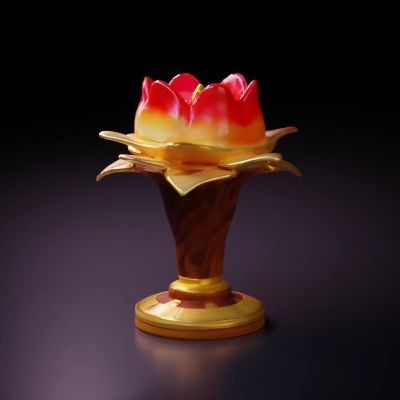 Lotus candle with flame, decorative pedestal.