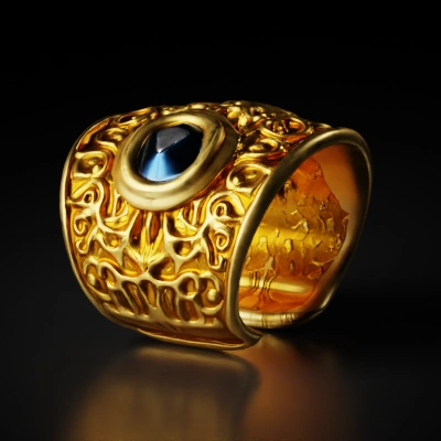 Ornate golden cuff with intricate patterns.