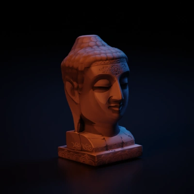 Buddha head statue, serene expression, traditional design.