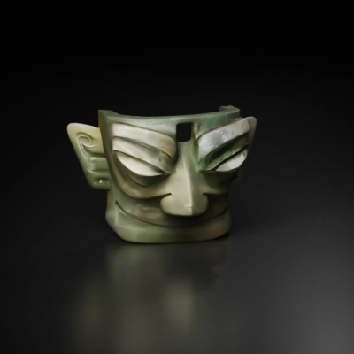 Ancient mask with large eyes and ears.