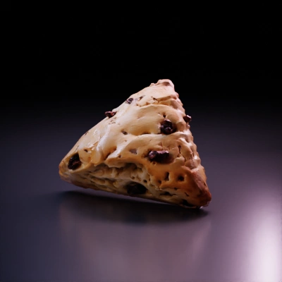 A triangular raisin scone.