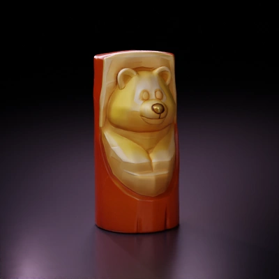 Carved wooden bear sculpture, simplistic form.