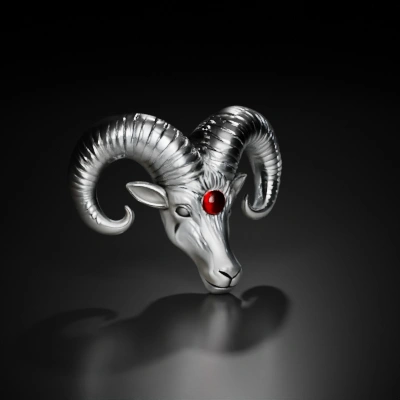 Silver ram head with red gem.