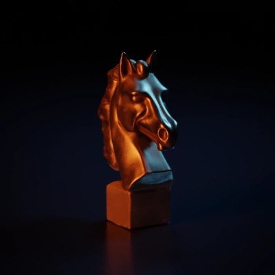 Horse head sculpture, ornately detailed mane
symmetric geometry.