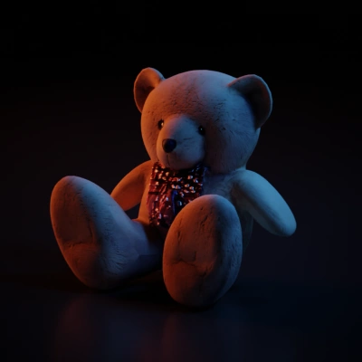 Stuffed teddy bear with a bow tie.