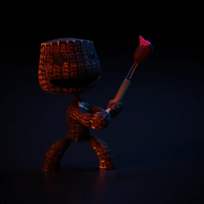 Knitted chibi big-geaded character with a paintbrush.