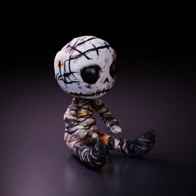 Rag doll with stitched eyes and mouth.