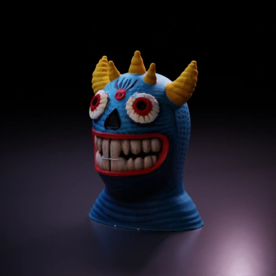 Knitted monster toy with big eyes.