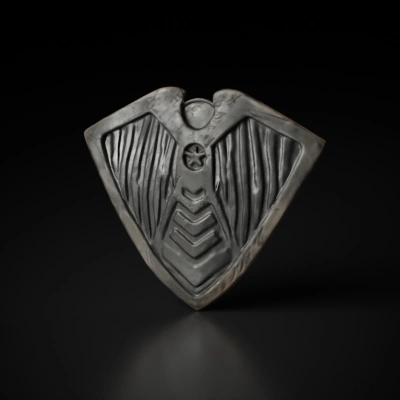 Triangular shield with intricate design, eagle motif.