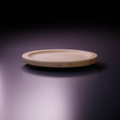 Wooden round plate with wood grain.