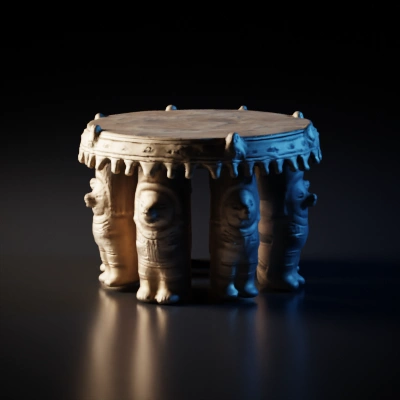 Ancient ceremonial drum with carved figures.