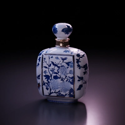 Porcelain bottle with floral design.