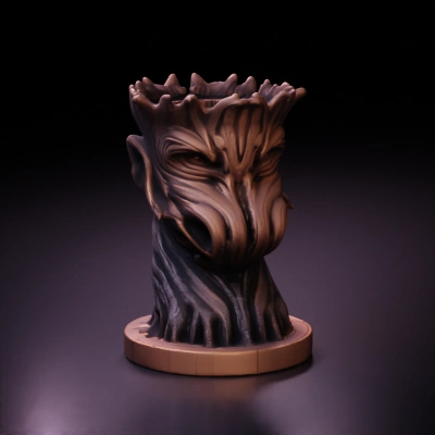 Tree trunk sculpture with a face.