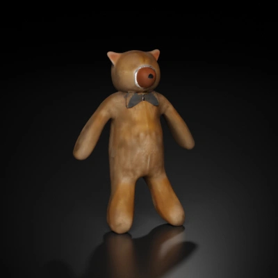 Stuffed teddy bear with black bowtie.