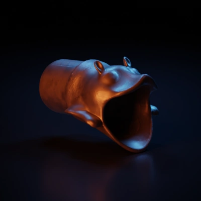 Ancient artifact with animal-like head, wide open mouth.