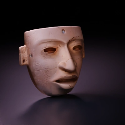 Ancient carved mask with humanoid features.