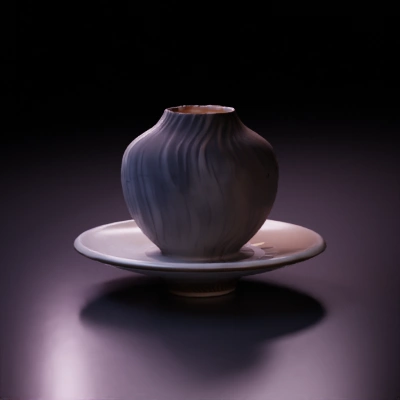 Teacup with wavy vertical ridges, handle, and saucer.