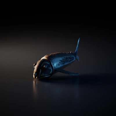 Fish-like metallic artifact with intricate pattern.