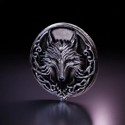 Wolf head emblem, ornate tribal design.