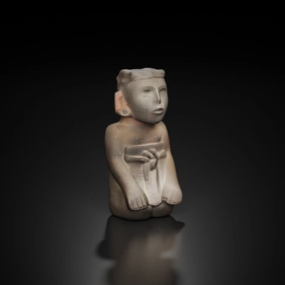 Stone statue of ancient human figure.