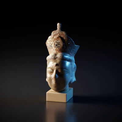 Ancient statue head with crown and closed eyes.