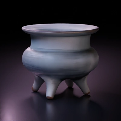 Ceramic vessel with three legs, rounded body.