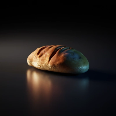 Loaf of bread, slightly rounded, natural texture.