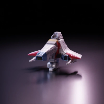 Futuristic spaceship with angular design and multiple thrusters.