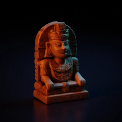 Mayan-style statue of a regal figure with intricate carvings.