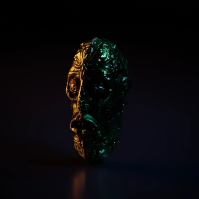 Alien head statue with intricate details, tribal design.