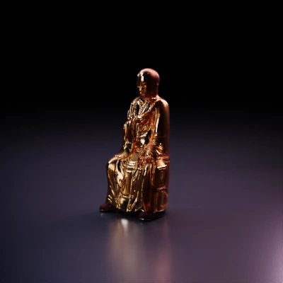 Buddhist monk statue holding prayer beads.