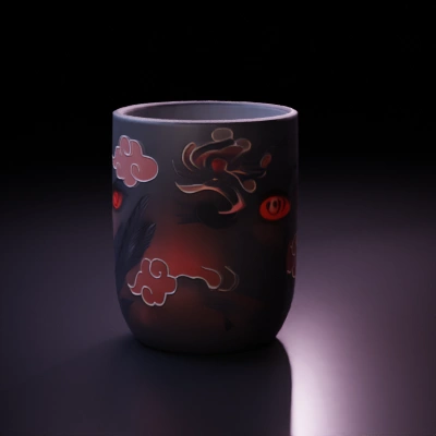 Naruto Akatsuki-themed mug with glowing red eyes.