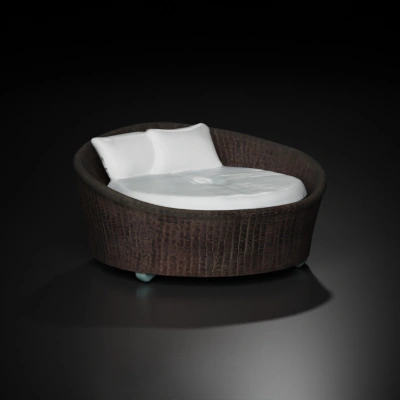 Round wicker daybed with cushions.