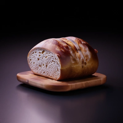 Half-sliced loaf of bread, fresh, with air bubbles.