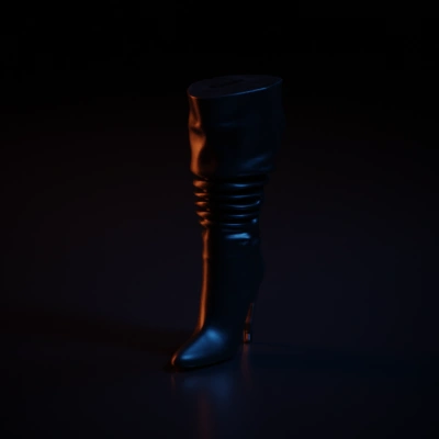 Heeled boot, high fashion, slouched design.