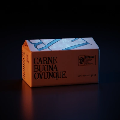 Rectangular cardboard box, promotional texts on sides.