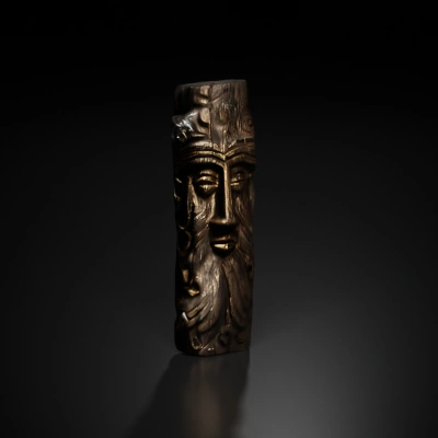 Wooden totem with carved slavic god face, old wood, intricate details.