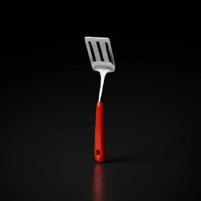 Kitchen spatula with slotted metal blade.