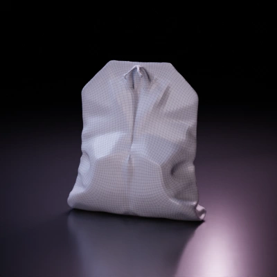 Used tea bag, string attached. smooth edges, simple geometry.